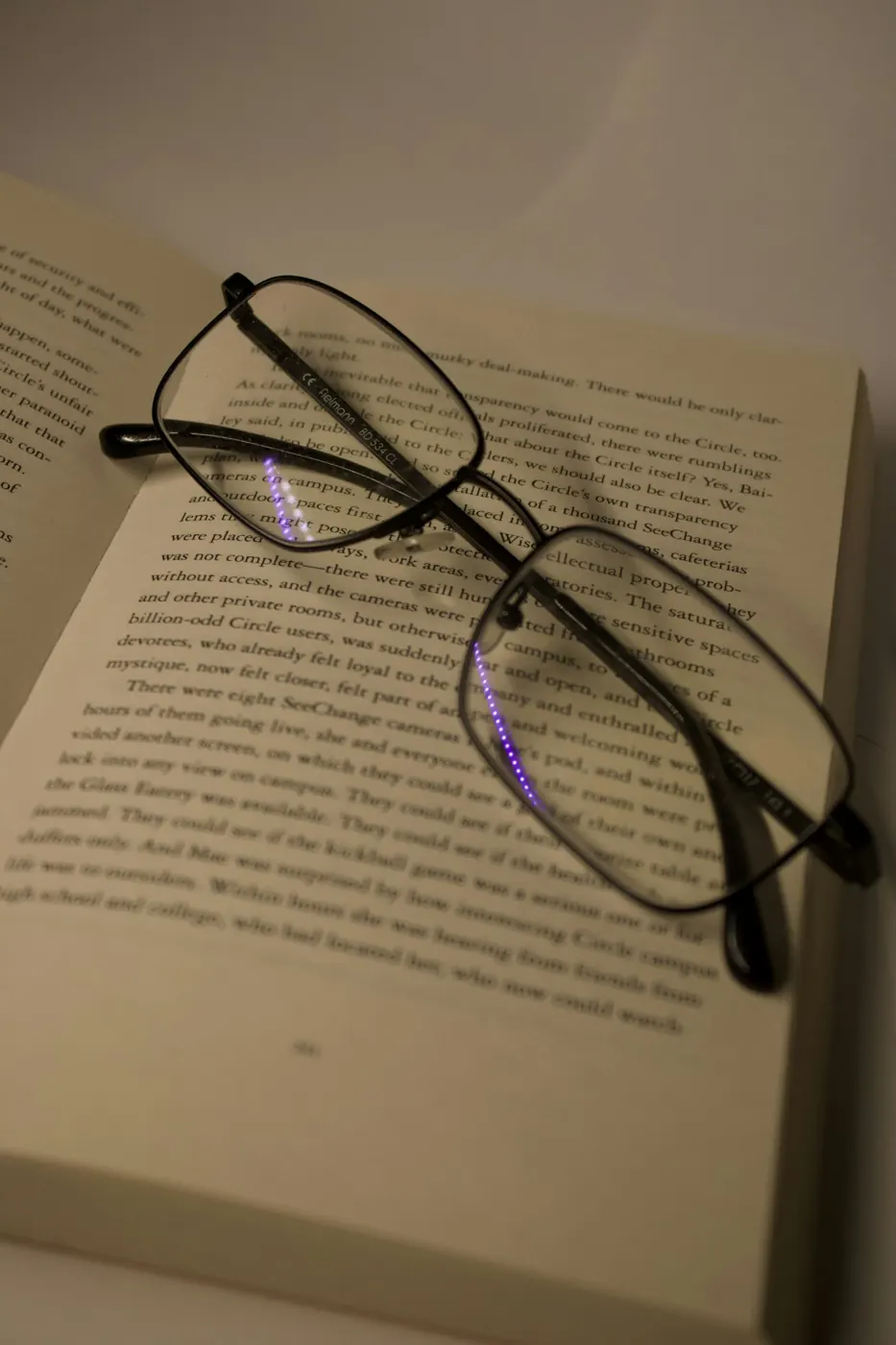 Eyeglasses resting on an open book