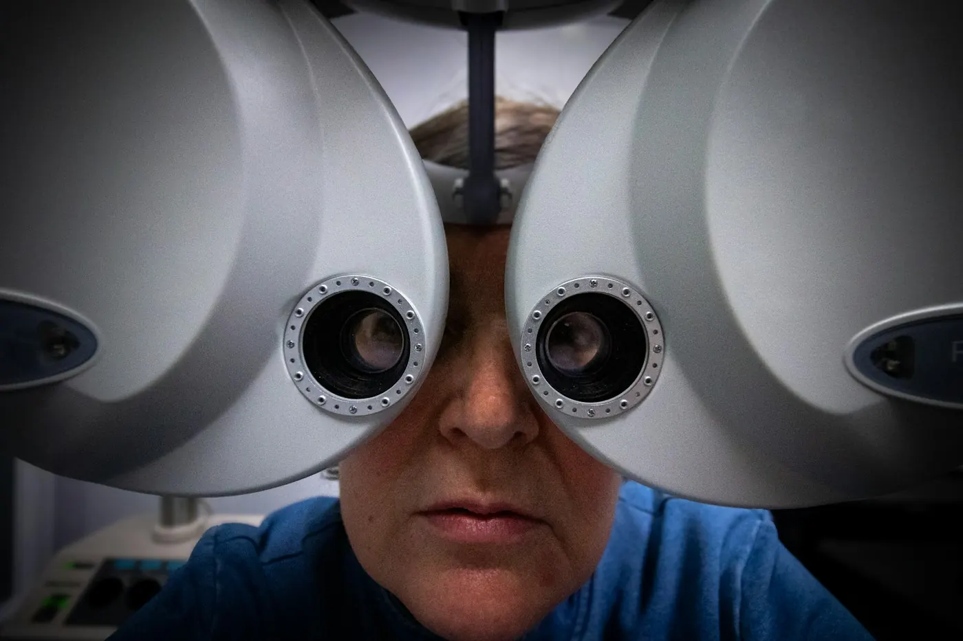 Patient positioned at an eye imaging instrument